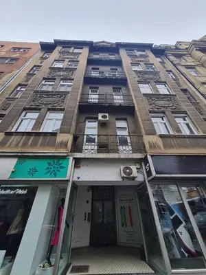 a tall building with windows and a door at Centrum in Belgrade