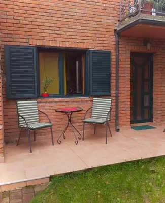 two chairs and a table on a patio at Taras House in Zvezdara