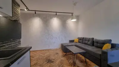 a living room with a couch and a table at Apartments near city center in Belgrade