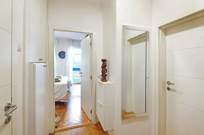 a hallway with a door leading to a bedroom at Apartment Paradise Exotic Star in Belgrade