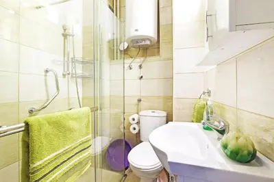 a bathroom with a toilet and a sink and a shower at Apartment Paradise Exotic Star in Belgrade