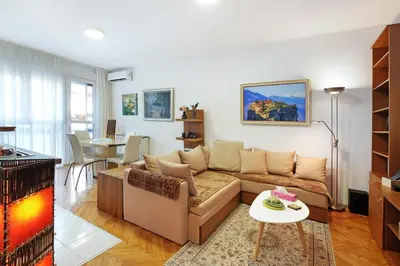 a living room with a couch and a table at Apartment Paradise Exotic Star in Belgrade