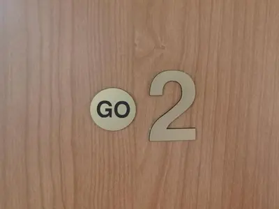 a sign that says go on a wooden door at GO 2 Apartment in Belgrade