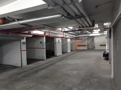 an empty parking garage with a car parked in it at GO 2 Apartment in Belgrade