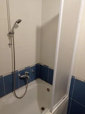 a bathroom with a shower and a bath tub at GO 2 Apartment in Belgrade