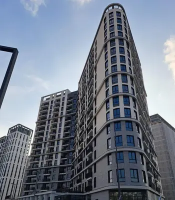 a tall building with many windows in a city at Belgrade Waterfront Metropolitan in Belgrade