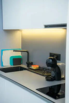 a kitchen with a sink and a counter top at Belgrade Waterfront Metropolitan in Belgrade