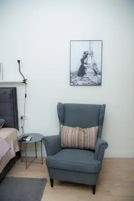 a room with a chair and a picture on the wall at Belgrade Waterfront Metropolitan in Belgrade