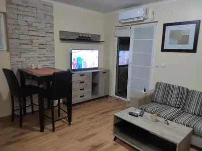 a living room with a table and a couch at Vidikovac 4 in Belgrade