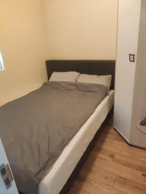 a bed in a small room with at Vidikovac 4 in Belgrade