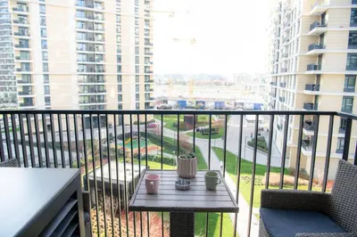 a balcony with a table and a view of a street at Belgrade Waterfront Metropolitan 2 in Belgrade