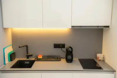 a kitchen counter with a sink and a mixer at Belgrade Waterfront Metropolitan 2 in Belgrade