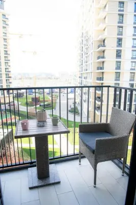 a balcony with a table and a chair on a balcony at Belgrade Waterfront Metropolitan 2 in Belgrade