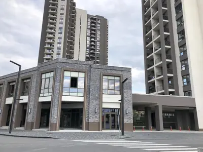 a building in front of two tall buildings at Cozy Belgrade Waterfront studio with Murphy bed in Belgrade