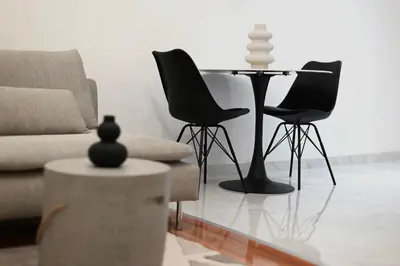a living room with a couch and chairs and a table at K2 Apartmani in Belgrade