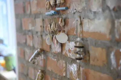 a brick wall with a bunch of different things on it at Vila Kraljev Breg Fruška Gora Pool and Padel in Čortanovci