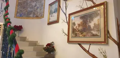 a wall with paintings and pictures on a wall at VANSVEL Boutique Apartment 7 in Belgrade