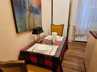 a table with a plate on top of it at VANSVEL Boutique Apartment 7 in Belgrade