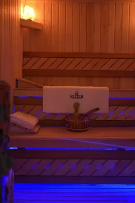 a table in a sauna with blue lights at Apartmani Elixir in Nova Pazova