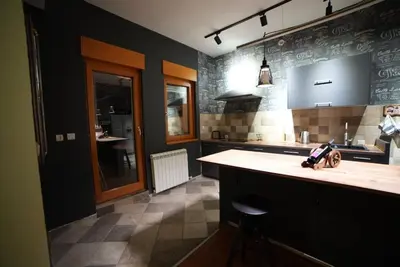 a kitchen with a counter and a sink in it at Turquoise orange, the art of vacation in Belgrade in Vračar (historical)
