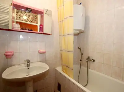 a bathroom with a sink and a tub and a shower at Apartment Lilian in Belgrade