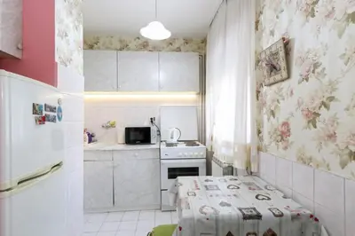 a small kitchen with a table in a room at Apartment Lilian in Belgrade