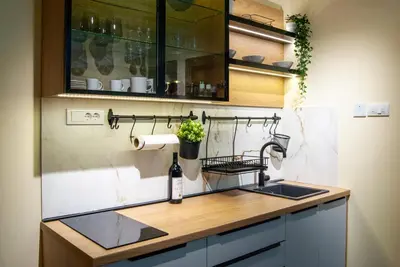 a kitchen with a sink and a counter top at N10 Apartment in Belgrade