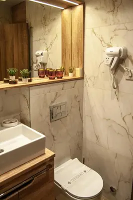 a bathroom with a toilet and a sink at N10 Apartment in Belgrade
