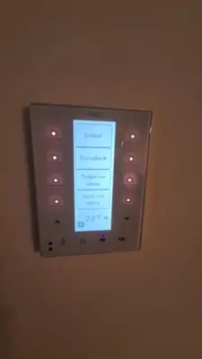 a television with a screen on a wall at West 65 apartment in Belgrade