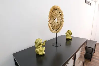 a table with a clock and two figurines on it at Marshal Dedinje in Belgrade
