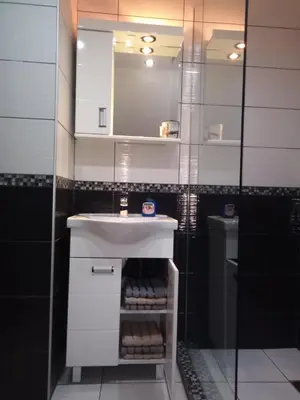 a bathroom with a white sink and a mirror at Happy House in Belgrade
