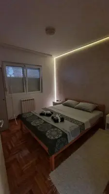 a bedroom with a bed in a room at Apartman Nikola in Žarkovo