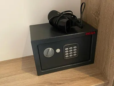 a black microwave with headphones on top of it at Konak Stella in Belgrade