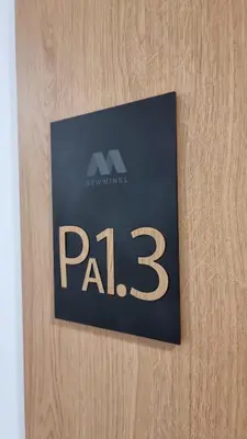 a sign on a door that says at Alek Place in Novi Beograd
