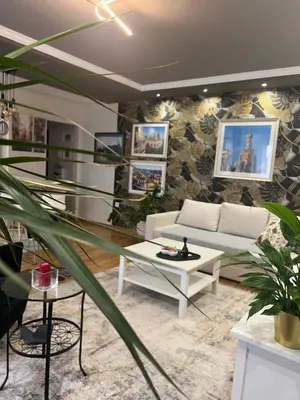 a living room with a couch and a table at M&M 22 in Belgrade