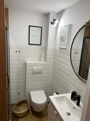 a bathroom with a toilet and a sink and a mirror at M&M 22 in Belgrade