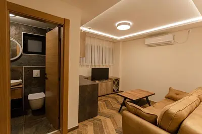 a living room with a couch and a table at Perla Lux apartmani in Inđija