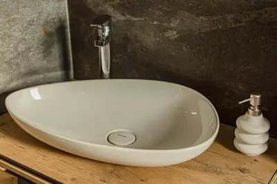 a white sink with a faucet in a bathroom at Perla Lux apartmani in Inđija