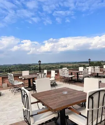a group of tables and chairs on a patio at Despot apartmani in Mladenovac