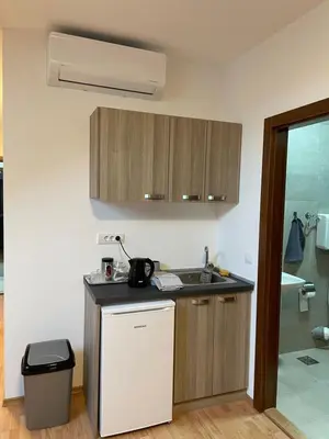 a kitchen with a sink and a counter top at Despot apartmani in Mladenovac