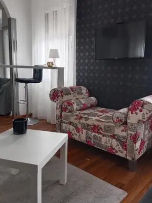 a living room with a couch and a table at Apartman 51 in Vračar (historical)