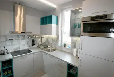 a white kitchen with a sink and a refrigerator at Apartment Div 2 in Dušanovac (historical)