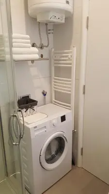 a washer and dryer in a small bathroom at Apartment Div 2 in Dušanovac (historical)