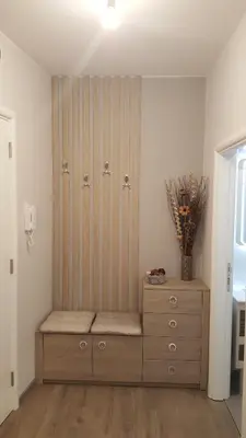 a room with a cabinet and a dresser with a vase at Apartment Div 2 in Dušanovac (historical)