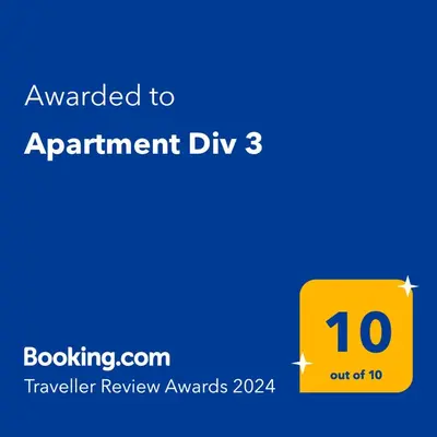 a yellow sign with the text awarded to appointment dip at Apartment Div 3 in Dušanovac (historical)