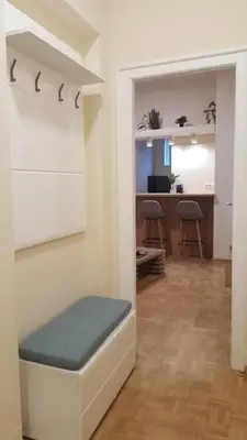 a living room with a bench and a desk at Apartment Div 3 in Dušanovac (historical)