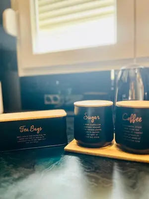 two containers of coffee sitting on a counter at Apartment Black Diamond - Vracar, Belgrade in Belgrade
