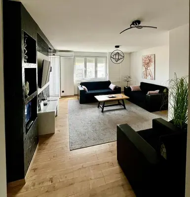 a living room with a couch and a table at Apartment Black Diamond - Vracar, Belgrade in Belgrade