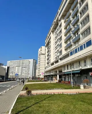 a large building on a street in a city at Apartment Belville, Suncokret 26 in Novi Beograd