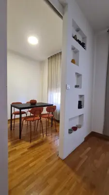 a dining room with a table and chairs at Apartment Belville, Suncokret 26 in Novi Beograd